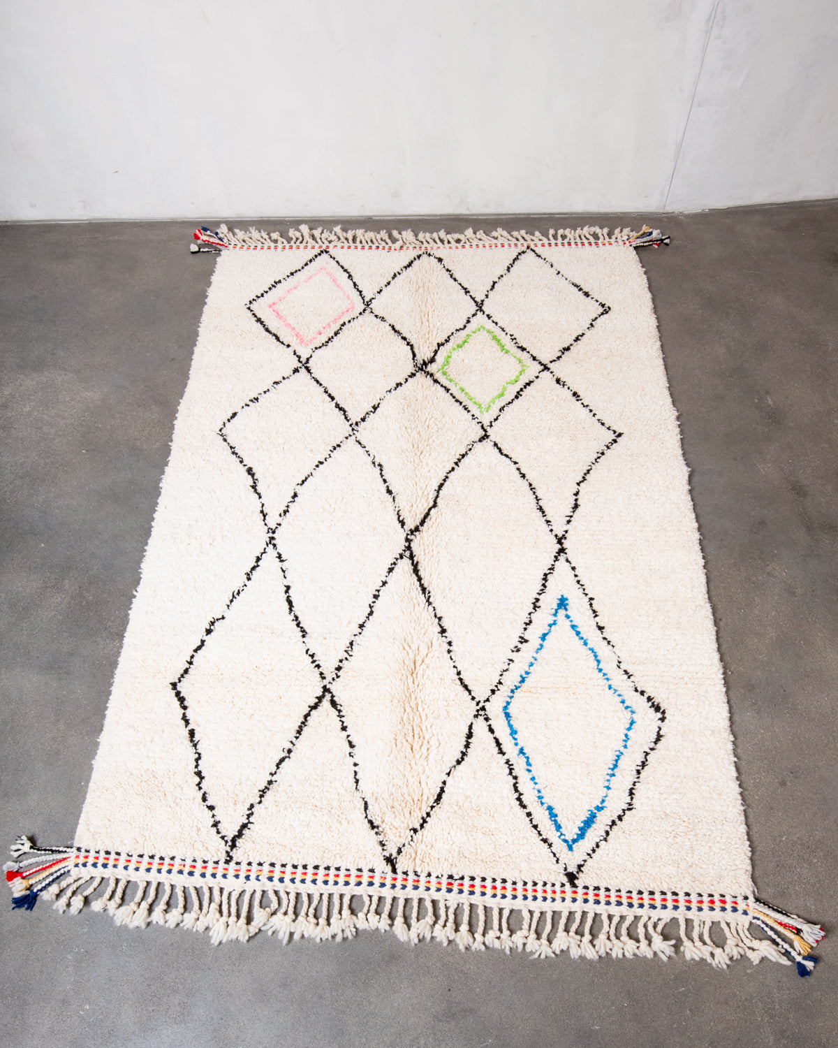 Modern, designer, handcrafted Berber rug from Morocco. Beniourain carpet with beautiful colours and patterns and fluffy wool texture.